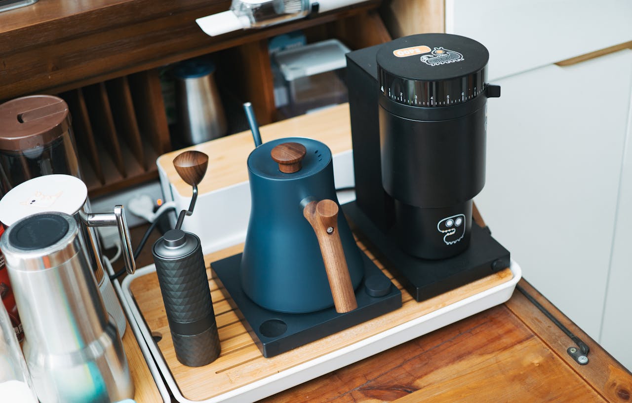 Stylish coffee grinder and kettle setup, perfect for a contemporary home barista.